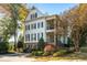 Beautiful white two-story home with black shutters and manicured landscaping at 2111 Cooper Lake Se Rd, Smyrna, GA 30080