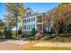 White two-story home with black shutters, a balcony, and landscaping at 2111 Cooper Lake Se Rd, Smyrna, GA 30080