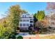 Charming white two-story home with black shutters and a brick walkway at 2111 Cooper Lake Se Rd, Smyrna, GA 30080