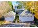 Aerial view of a house with a two-car garage and a landscaped path at 2111 Cooper Lake Se Rd, Smyrna, GA 30080