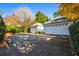 View of a two-car garage with white doors and a concrete driveway at 2111 Cooper Lake Se Rd, Smyrna, GA 30080