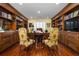 Traditional home office with floor-to-ceiling bookshelves and hardwood floors at 2111 Cooper Lake Se Rd, Smyrna, GA 30080