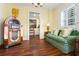 Cozy lounge area with a jukebox, comfortable seating, and charming decor at 2111 Cooper Lake Se Rd, Smyrna, GA 30080