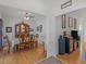 Dining room featuring hardwood floors, a wooden table with chairs, and a hutch at 318 Dogwood Trce, Mcdonough, GA 30252