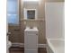 Updated bathroom with white vanity and tub at 1807 Oakmont Nw Dr, Atlanta, GA 30314