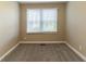 Simple bedroom with neutral walls and carpeted floors at 1807 Oakmont Nw Dr, Atlanta, GA 30314