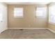 Bright bedroom with neutral walls, carpet, and ample closet space at 1807 Oakmont Nw Dr, Atlanta, GA 30314