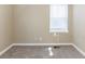 Simple bedroom with a window and neutral-colored carpet at 1807 Oakmont Nw Dr, Atlanta, GA 30314