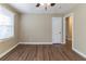 Spacious bedroom with wood-look flooring and ceiling fan at 1807 Oakmont Nw Dr, Atlanta, GA 30314