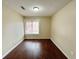 Simple bedroom with window and wood floors at 1153 Village Main St, Stone Mountain, GA 30088