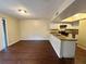 Dining area with dark wood floors and access to the kitchen at 1153 Village Main St, Stone Mountain, GA 30088