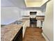 Kitchen with white cabinets, stainless steel appliances, and a double sink at 1153 Village Main St, Stone Mountain, GA 30088