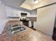 Kitchen with white cabinets, stainless steel appliances, and a double sink at 1153 Village Main St, Stone Mountain, GA 30088