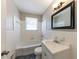Clean bathroom with white tile and a bathtub at 3457 Springlake Dr, Decatur, GA 30032