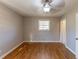Hardwood floors and a ceiling fan in this bedroom at 3457 Springlake Dr, Decatur, GA 30032