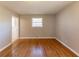 Simple bedroom with hardwood floors and window at 3457 Springlake Dr, Decatur, GA 30032