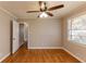 Bright bedroom with hardwood floors and ceiling fan at 3457 Springlake Dr, Decatur, GA 30032