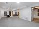 Open basement layout with versatile space and simple white walls at 4378 Ridge Ct, Loganville, GA 30052