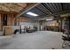 Unfinished basement with concrete floors, exposed ceiling, and storage at 4378 Ridge Ct, Loganville, GA 30052