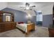 Bedroom with blue walls, carpet, and wooden furniture at 4378 Ridge Ct, Loganville, GA 30052
