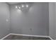 Bonus room with gray walls and wood-look flooring at 4378 Ridge Ct, Loganville, GA 30052