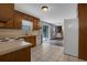 Kitchen boasts wood cabinets, white appliances, and access to a back deck at 4378 Ridge Ct, Loganville, GA 30052