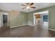 Cozy living area with hardwood floors, ceiling fan, and access to the kitchen and staircase at 4378 Ridge Ct, Loganville, GA 30052