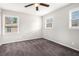 Spacious bedroom with neutral walls, gray carpet, and ceiling fan at 2625 Crestdale Se Cir, Atlanta, GA 30316