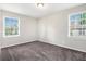 Spacious bedroom with two windows and grey carpet at 2625 Crestdale Se Cir, Atlanta, GA 30316