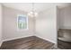 Simple dining room with hardwood floors and a chandelier at 2625 Crestdale Se Cir, Atlanta, GA 30316