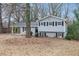 Gray house with a covered carport and a well-maintained lawn at 2625 Crestdale Se Cir, Atlanta, GA 30316