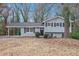 Gray house with a covered carport and a well-maintained lawn at 2625 Crestdale Se Cir, Atlanta, GA 30316