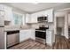 Renovated kitchen, featuring stainless steel appliances and granite countertops at 2625 Crestdale Se Cir, Atlanta, GA 30316