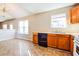 Kitchen with oak cabinets, tile floor, and window at 3717 Waldrop Hills Dr, Decatur, GA 30034