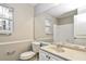 Clean bathroom with white vanity, beige countertop, and tiled shower at 1344 Mill Lake Cir, Stone Mountain, GA 30088