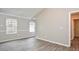 Spacious bedroom with vaulted ceilings, wood-look floors, and ample natural light at 1344 Mill Lake Cir, Stone Mountain, GA 30088
