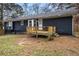 House exterior showcasing a deck and a spacious backyard at 155 Meadowbrook Dr, Mcdonough, GA 30253