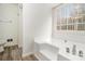 Bathroom with a large bathtub and a window overlooking the backyard at 155 Meadowbrook Dr, Mcdonough, GA 30253