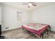 Bedroom with wood-look floors and ceiling fan at 155 Meadowbrook Dr, Mcdonough, GA 30253