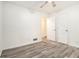 Bright bedroom with wood-look floors and access to bathroom at 155 Meadowbrook Dr, Mcdonough, GA 30253