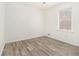 Well-lit bedroom featuring wood-look floors at 155 Meadowbrook Dr, Mcdonough, GA 30253