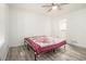 Bedroom with wood-look floors and ceiling fan at 155 Meadowbrook Dr, Mcdonough, GA 30253
