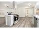 Modern kitchen with white cabinets, stainless steel appliances, and an island at 155 Meadowbrook Dr, Mcdonough, GA 30253