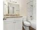 Clean bathroom with granite countertops, white vanity, and a bathtub at 2329 Wilkins Cv, Decatur, GA 30035