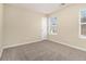 Simple bedroom with carpet, window, and closet at 2329 Wilkins Cv, Decatur, GA 30035