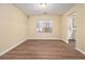 Simple dining room with hardwood floors and a window at 2329 Wilkins Cv, Decatur, GA 30035