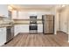 Kitchen with white cabinets, granite counters, and stainless steel appliances at 2329 Wilkins Cv, Decatur, GA 30035