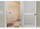 Unfinished laundry room with hookups and a louvered door at 2329 Wilkins Cv, Decatur, GA 30035