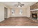 Bright living room with hardwood floors and a stone fireplace at 2329 Wilkins Cv, Decatur, GA 30035