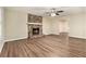 Living room features a stone fireplace and wood-look flooring at 2329 Wilkins Cv, Decatur, GA 30035